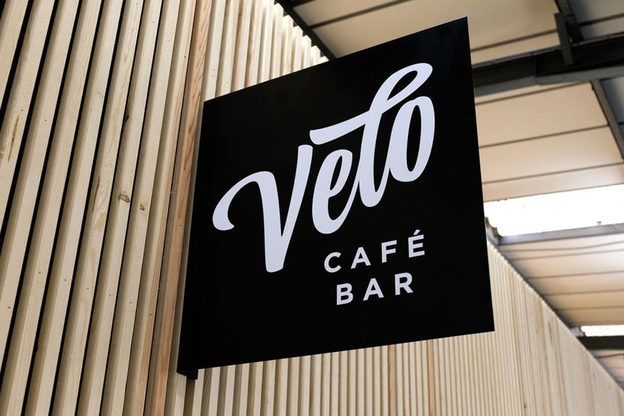 Bent metal projecting sign