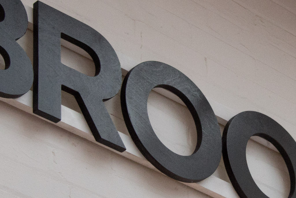 Plywood letters on wooden bars