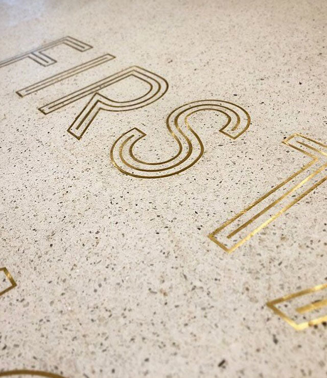 Brass letters in concrete