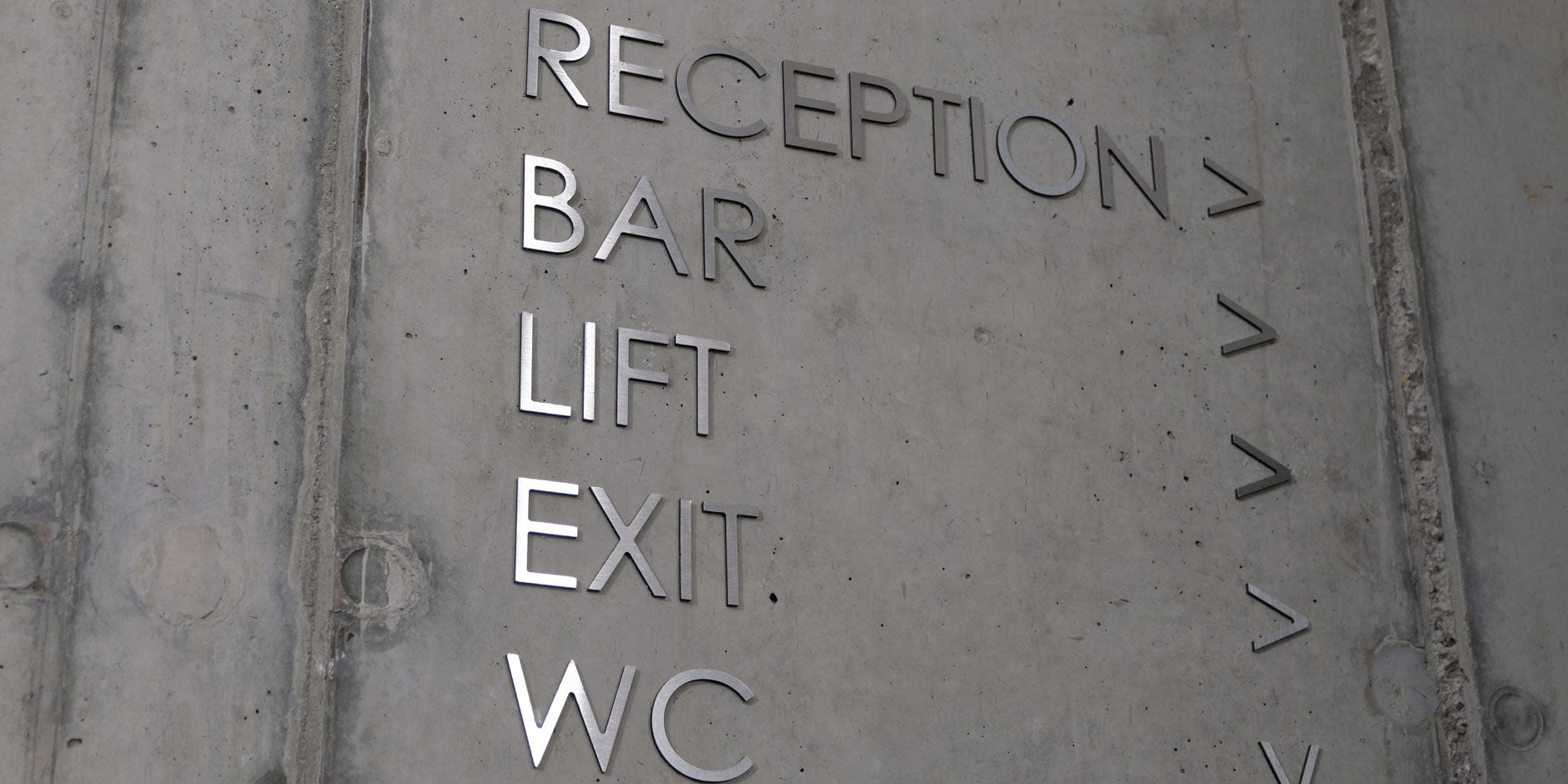 Concrete floor/Steel Wayfinding