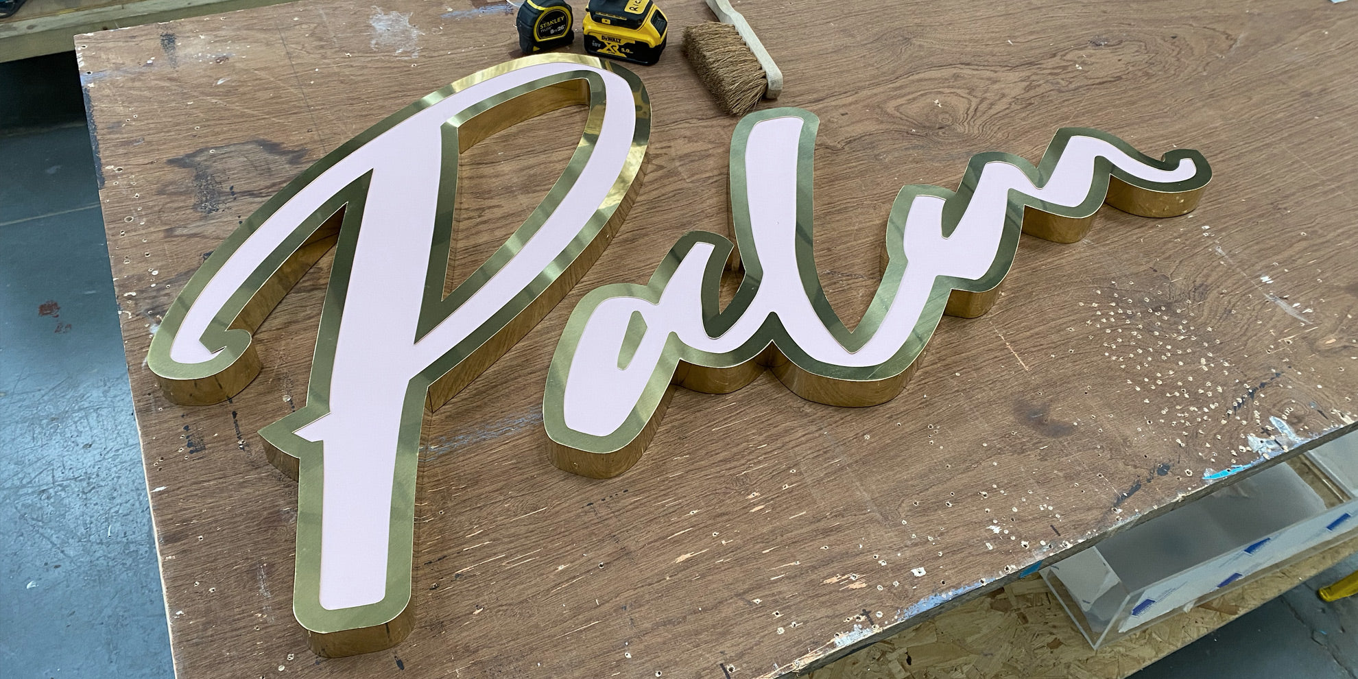 Pink and brass letters