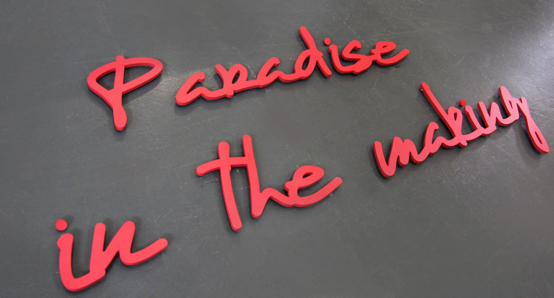 Red painted letters in a script font