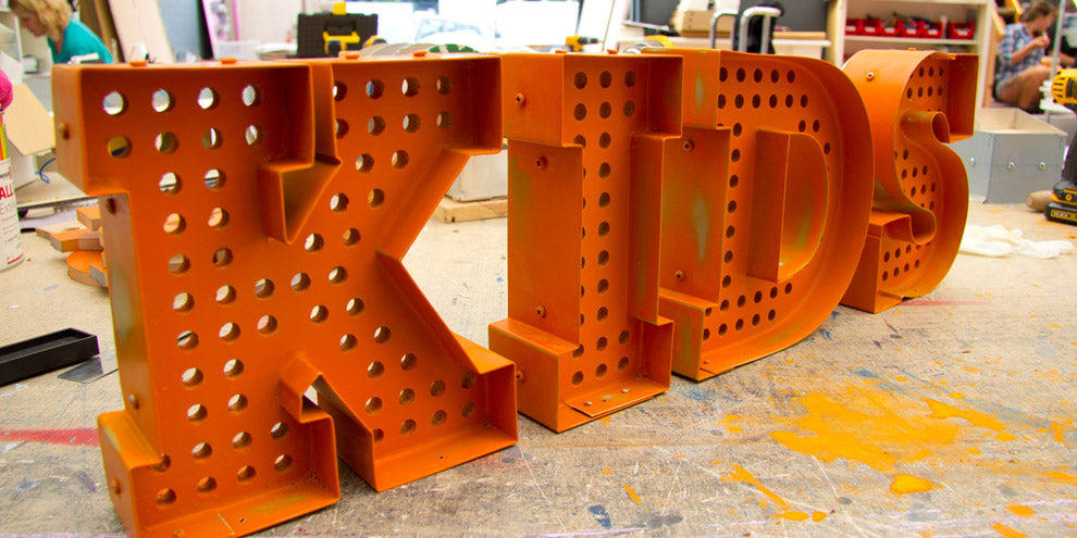 worn industrial letters